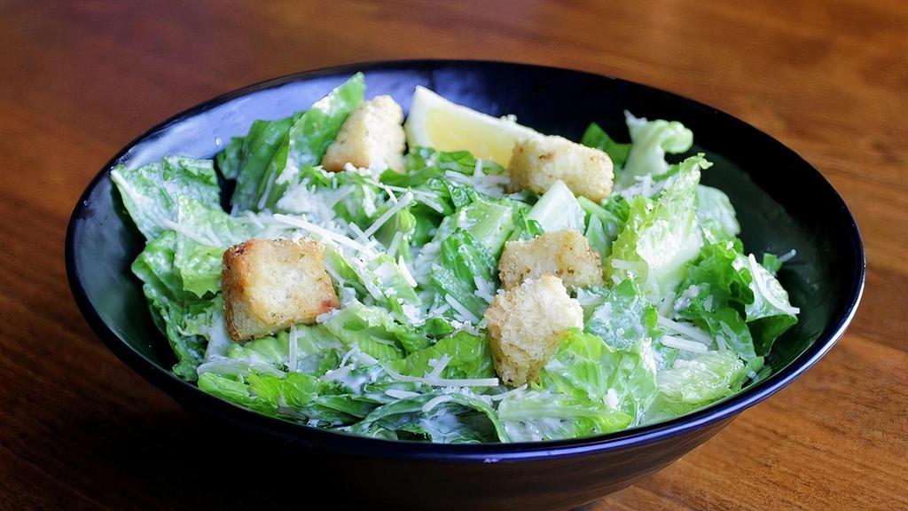 Caesar Salad (D) · Romaine, parmesan, tossed in house-made Caesar dressing, topped with parmesan croutons.