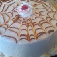 Caramel Cake · TRES LECHES STYLE VANILLA CAKE, WITH CARAMEL AND WALNUT FILLING, TOPPED WITH CREAM CHEESE FR...