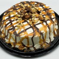 Snickers Cake · CHOCOLATE CAKE FILLED WITH CHOCOLATE, CARAMEL AND PEANUTS. COVERED WITH CREAM CHEESE FROSTIN...