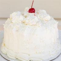 Coconut Cream Cake · VANILLA CAKE MOISTENED WITH COCONUT MILK FILLED WITH COCONUT CREAM AND COVERED WITH OUR SPEC...