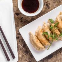 Pot Stickers (6) · Stuffed with seasoned pork, spices and minced vegetables, cooked golden  or steamed. Served ...