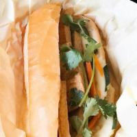 Banh Mi Lemongrass Tofu · French baguette served with homemade butter, fried onion, cucumber, cilantro, jalapeno, pick...