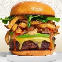 Beast Burger · American beef patty topped with parmesan fries, avocado, caramelized onions, ketchup, and ai...