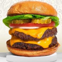 Double Cheeseburger · Two american beef patties topped with melted cheese, buttered lettuce, tomato, onion, and pi...