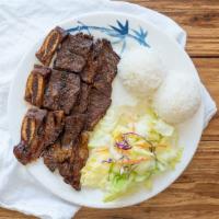 Short Rib Teriyaki Plate · Grilled short ribs with house-made teriyaki sauce, side salad and rice.
