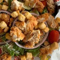 Fried Chicken Salad · Our fresh salad with tomato, red onion, cucumbers, shredded Parmesan cheese, croutons and ch...