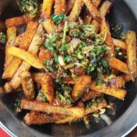 Street Fries · Vegan, gluten-free. Crispy potatoes tossed with sichuan peppercorn, chilies, cilantro, and s...