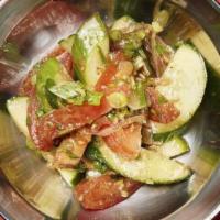 Cucumber Salad · Cucumbers, tomatoes, red onion, scallions, and cumin.