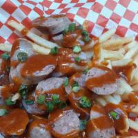 Currywurst · Sliced Zenners sausages with sweet curry ketchup on a bed of fries
