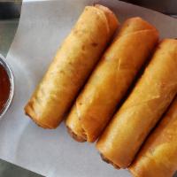 Spring Rolls · Vegan. Crispy spring rolls with vermicelli noodles, cabbage, and carrots.