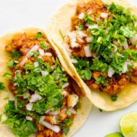 Chicharron · Pork tacos that come with a soft corn tortilla. This tacos is made with a red sauce and all ...