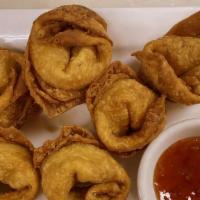 Crab Meat Rangoon (6 Pieces) · Crab meat & cream cheese rolled in deep fried wonton shell.