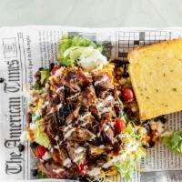 Bbq Salad · A blend of Romaine and spring mix topped with creamy corn, tomatoes, black beans, shredded c...