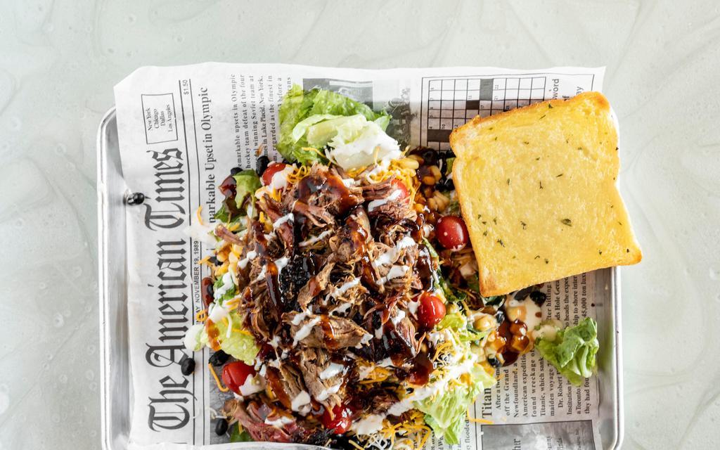 Side Salad · Made with a blend of Romaine and spring mix and topped with black beans and tomatoes
