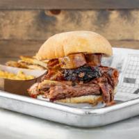 The Carnivore · A meat-lover's dream! Brisket, pork, chicken & sausage loaded on a toasted ciabatta bun with...
