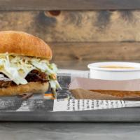 The Pot Belly · A hearty sandwich made with your choice of meat topped with Pepper Jack cheese & coleslaw on...