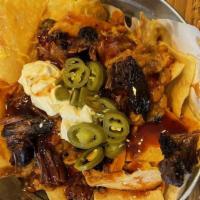 Bbq Nachos · Tortilla chips covered with melted cheese, your choice of meat, bbq beans, sour cream, jalap...