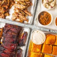 Pack #3 · Feeds 8-10 People
Includes 3 lbs of meat, 1 full rack of ribs, 4 sides (1 pint each) & 10 br...