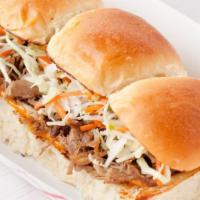 4 Aloha Sliders · Kalua pork, sweet Hawaiian rolls, Nunya Sauce, slaw.