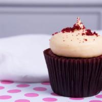 Red Velvet Cupcake · Our famous red velvet cake topped with cream cheese swirl and crumbled red velvet cake. Limi...