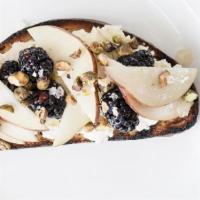 Ricotta Toast · House-made Ricotta, Seasonal Fruit, Honey, Pistachio