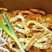 Pad Thai · Stir-fried thin rice noodle with pad Thai sauce, eggs, bean sprout, and Green onion served w...