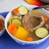 Caldo De Rez · Beef shank and vegetable soup served with a side of rice and choice of corn or flour tortillas