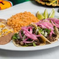 Three Taco Plate · Three tacos with choice of meat & tortilla shells served with lettuce, tomato, cheese and a ...