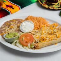 Rolled Taquitos Plate · Four rolled chicken or beef taquitos topped with cheese and served with a side of guacamole ...