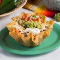 Taco Salad · Crispy taco shell filled with lettuce, beans, cheese, choice of meat, topped with sour cream...