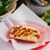 Mexican Hot Dog · Fried bacon wrapped hotdog served with mayo, mustard, ketchup, and topped with grilled onions