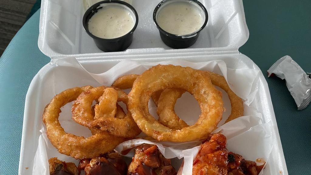 Onion Rings · Delicious crispy onion rings, comes with ranch sauce.