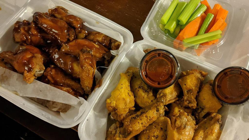 10 Pieces Hot Wings Combo · 10 classic (bone-in) wings with up to two flavors, crinkle cut fries, veggie sticks, one dip and a drink.