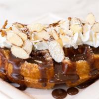 Nutella + Almond · Freshly baked croffles (croissant + waffles) with airy whipped cream and nutella & almond to...