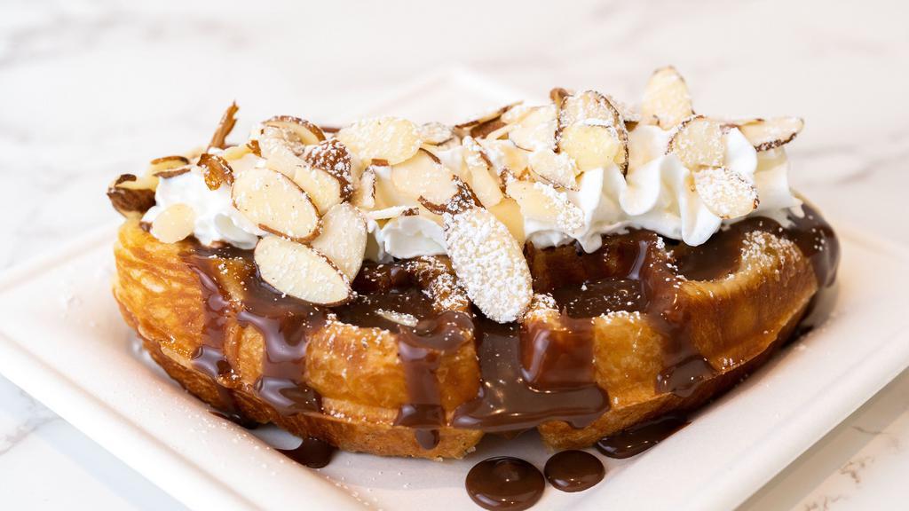 Nutella + Almond · Freshly baked croffles (croissant + waffles) with airy whipped cream and nutella & almond toppings