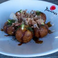 Takoyaki (6 Pieces) · Ball shaped minced octopus in wheat flour-based batter.
