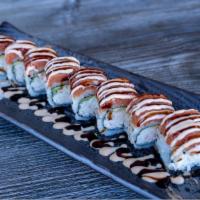 Hot Night Roll · Crab mix and avocado inside spicy tuna on top with spicy mayo and Eel sauce.