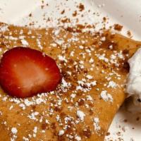 Strawberry Short Crepe · Whipped cream, Strawberries, and Biscoff cookies.