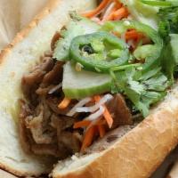 Garlic Soy Steak Banh Mi · Steak marinated in garlic soy sauce and grilled over open flame.