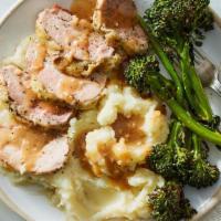 Pork Loin With Cranberry Sauce · Tender rosemary pork loin on a bed of homemade buttery mashed potatoes, mixed vegetables and...