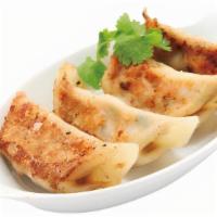 Pan-Fried Gyoza (6 Pcs) · Crispy pan-fried dumplings filled with juicy pork and veggies.
