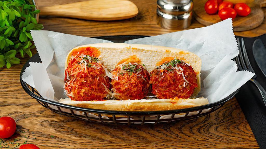 Marinara Meatballs Sandwich · Three meatballs covered in marinara sauce and melted Parmesan cheese on deli roll.