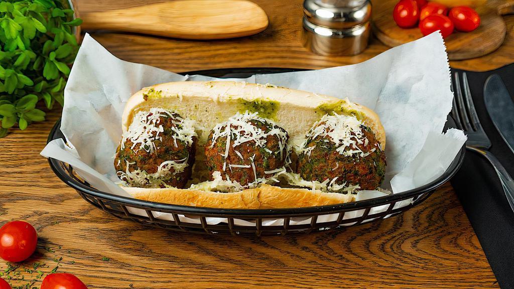 Pesto Meatball Sandwich · Three meatballs covered in Pesto sauce and melted Parmesan cheese on deli roll.