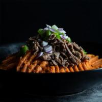 Good For You Nachos · Sweet potato “fries” topped with shredded beef, guacamole, salsa, green peppers and red onio...