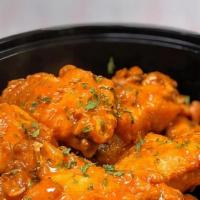 Mild Buffalo · Tossed in our mild buffalo wing sauce