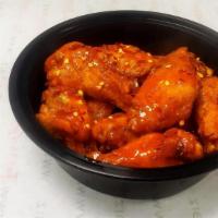 Extra Hot Buffalo · Tossed in our spicier buffalo wing sauce and topped with crushed red pepper flakes