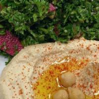 Classic Hummus · Mashed chick peas, blended with tahini (sesame seed oil), lemon juice, and garlic. Served wi...