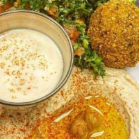 Vegetarian Sampler · Hummus, Baba ghanoush, grape leaves, and falafel served with pita bread.