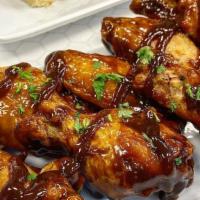 Chicken Wings (8 Pieces) · Deep fried tossed in one of our special sauces: BBQ, hot, or spicy sriracha. With a side of ...