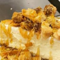 Baklava Cheesecake · Cheesecake topped with crumbled baklava, pistachio and honey.